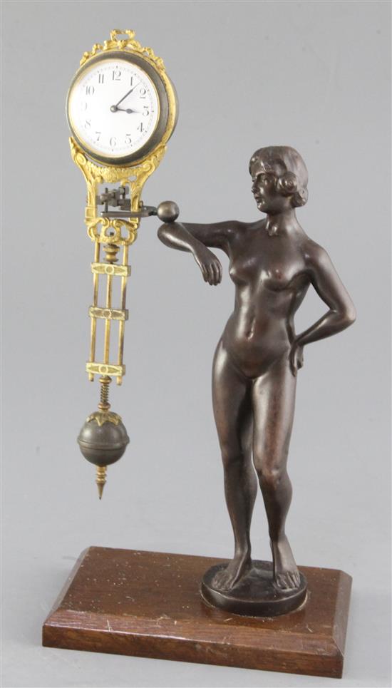 A late 19th century German bronze mystery timepiece, height 11.75in.